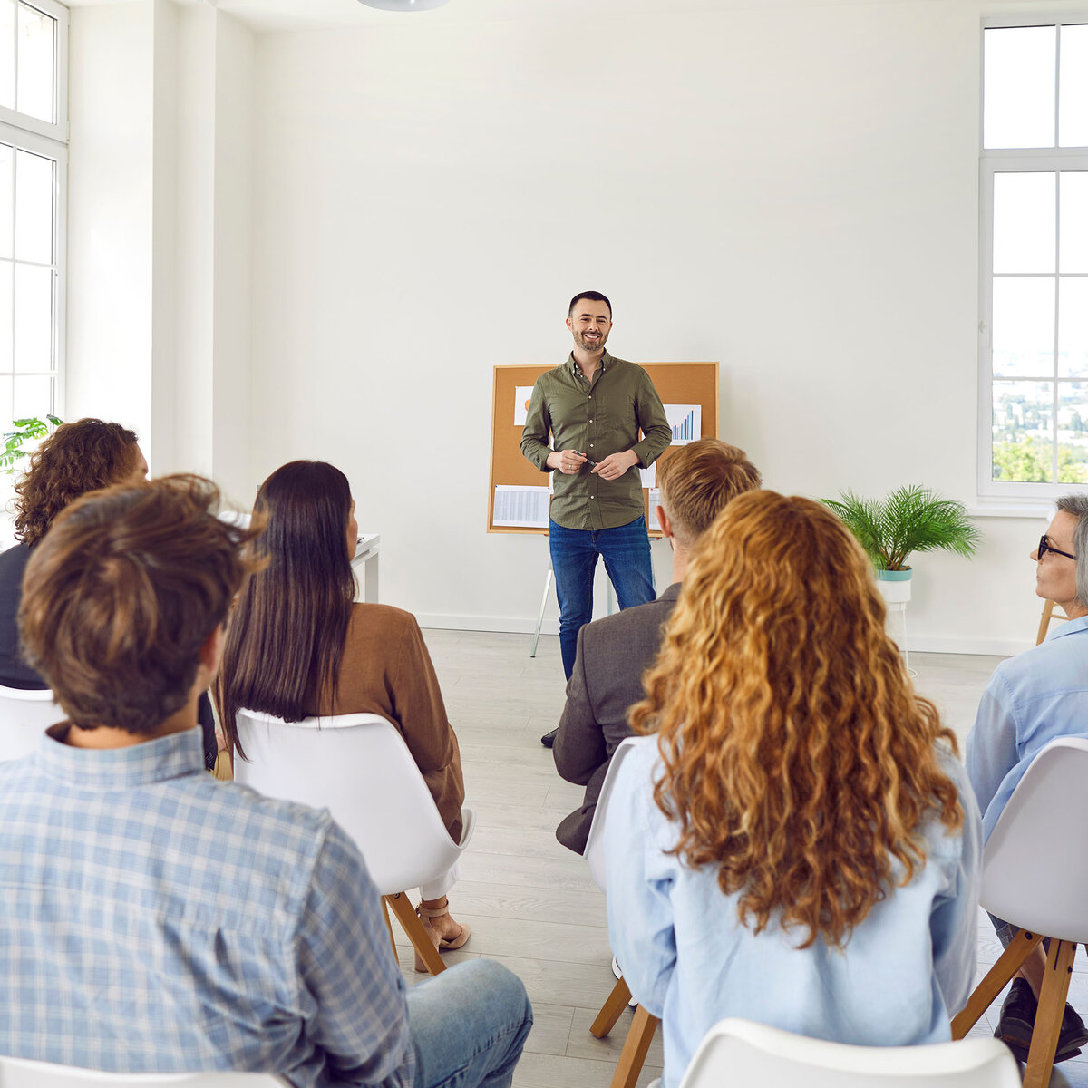 Employees attending corporate business training seminar